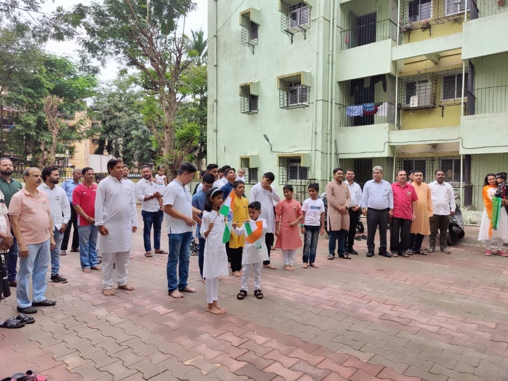 Children and residents with Indian flags at Panchavati society